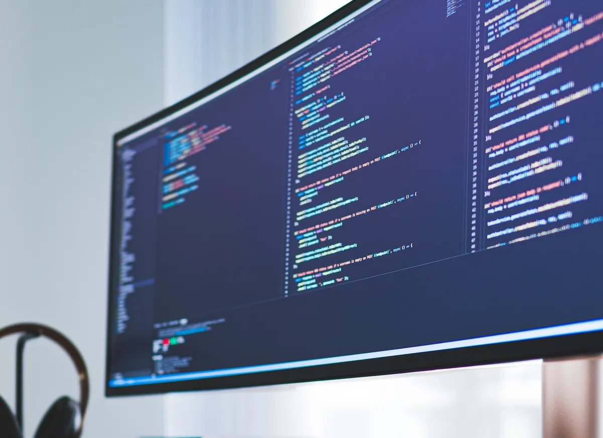 Photo of a monitor showing HTML code