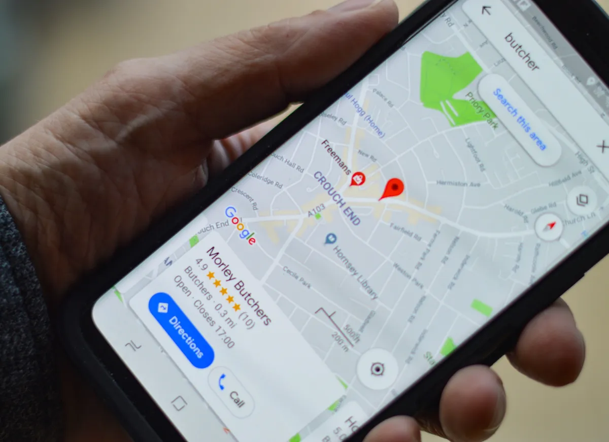 Phone in someone's hand showing a Google map